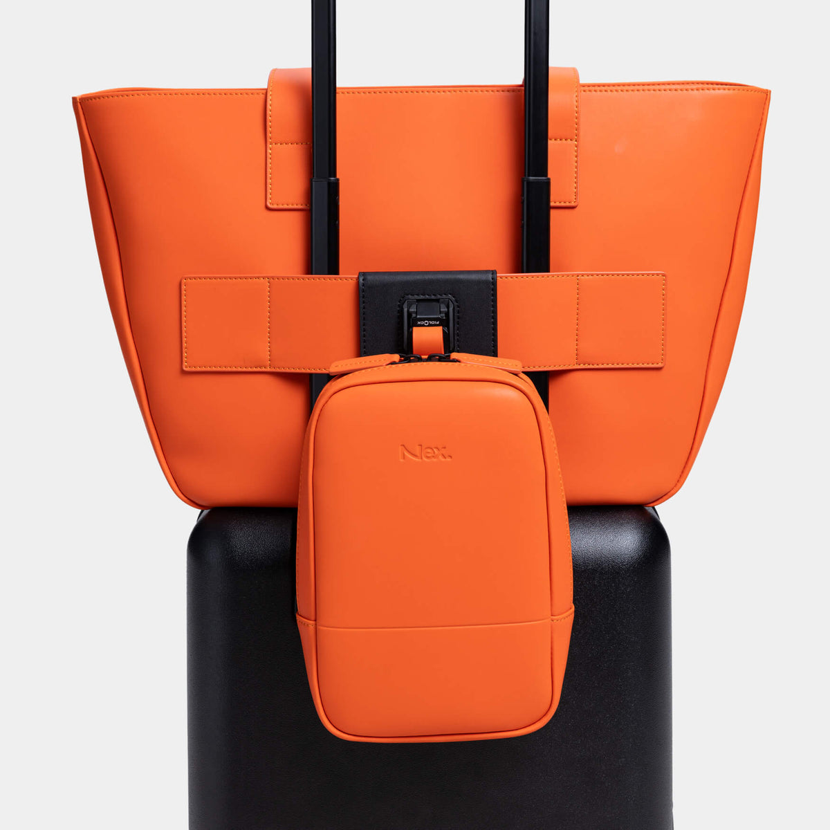 An M1 chest bag attached to a luggage sleeve with the Magnetic Dock